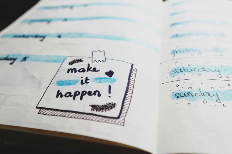 Journal that says 'Make it Happen' — representing motivation and action in therapy